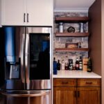 Clay Kitchen Remodel cherry distressed base cabinets and white upper cabinets