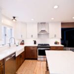 Clay Kitchen Remodel cherry distressed base cabinets and white upper cabinets