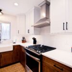Clay Kitchen Remodel cherry distressed base cabinets and white upper cabinets