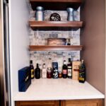 Clay Kitchen Remodel cherry distressed base cabinets and white upper cabinets