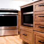 Clay Kitchen Remodel cherry distressed base cabinets and white upper cabinets