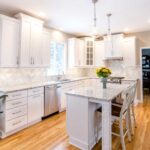 Kitchen remodel with white cabinets, quartz countertops and modern finishes