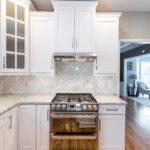 Kitchen remodel with white cabinets, quartz countertops and modern finishes
