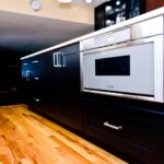 Liverpool NY kitchen remodel with custom beverage center and dark wood cabinetry