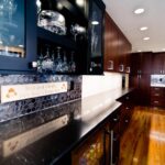 Liverpool NY kitchen remodel with custom beverage center and dark wood cabinetry