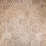 Kitchen remodel with white cabinets, custom wood range hood and hexagon tile backsplash