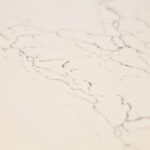 White modern kitchen remodel in Onondaga NY with bright cabinetry and light countertops