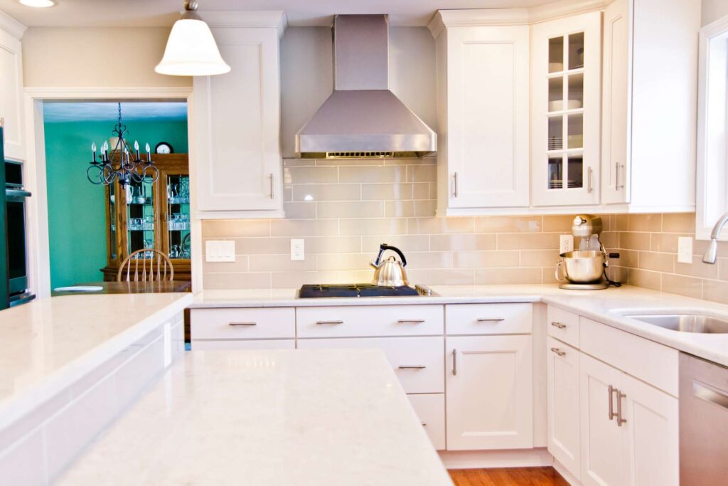Kitchen remodel with white cabinets, large island and open layout